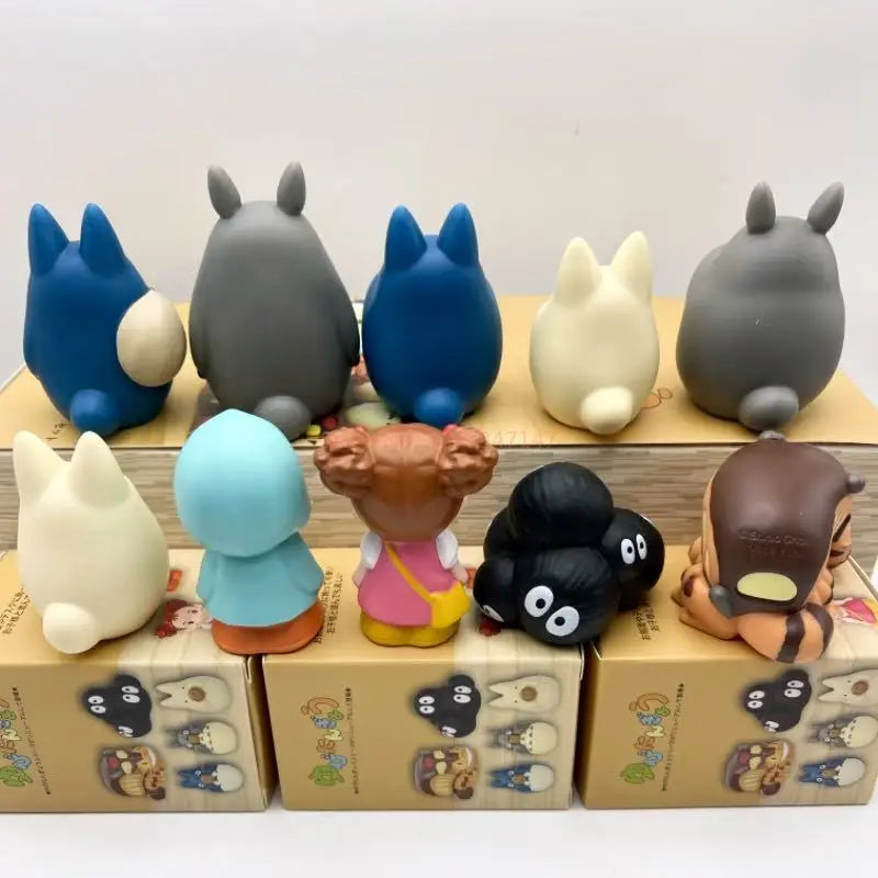 Set of cute cartoon blind box figurines with Totoro-like faces in multiple colors