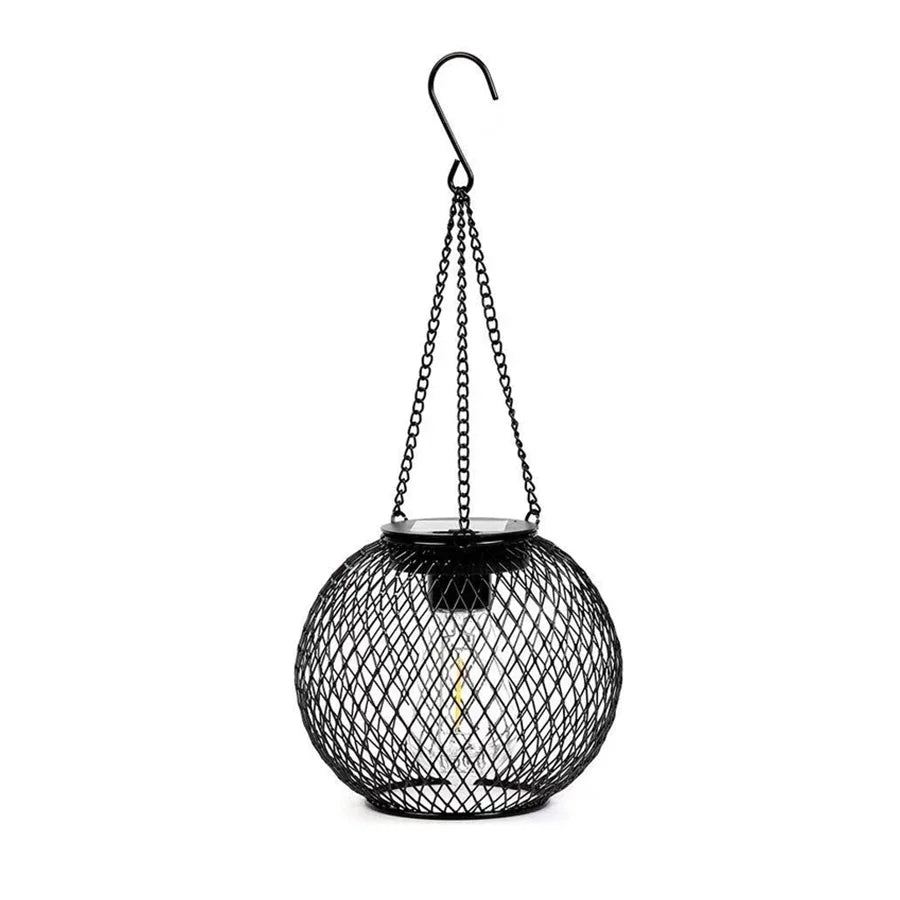 Hanging solar LED lantern with black wire mesh globe and metal hanging loop