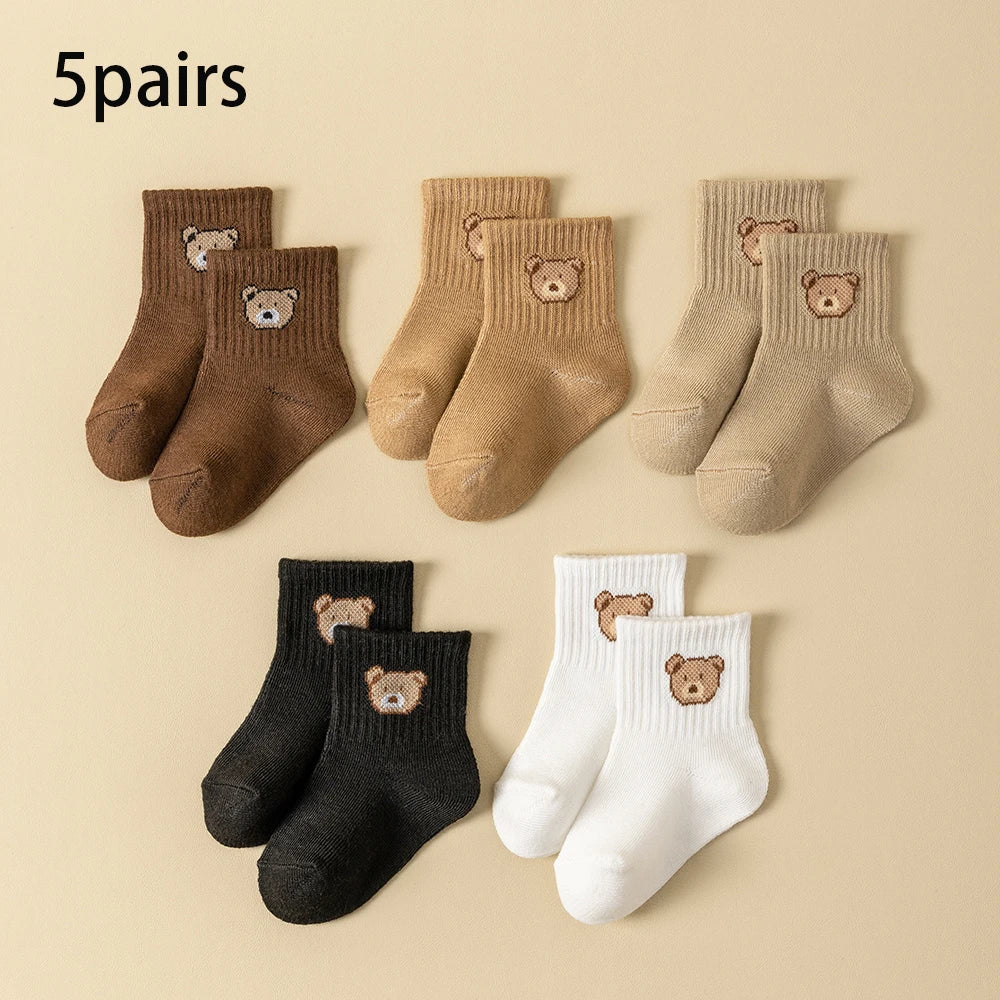 5-pair baby sock set with cartoon bear faces, ribbed cuffs, mixed dark and light colors