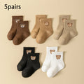 5-pair baby sock set with cartoon bear faces, ribbed cuffs, mixed dark and light colors