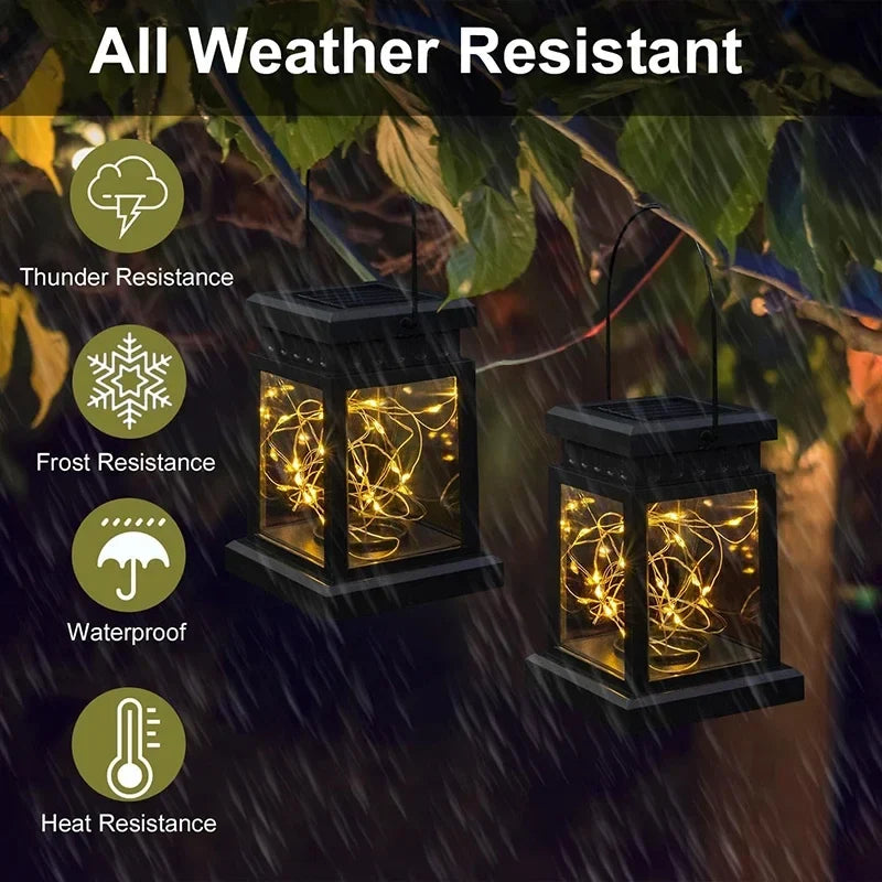 Black solar lantern with lit glass, showing warm decorative glow for outdoor use