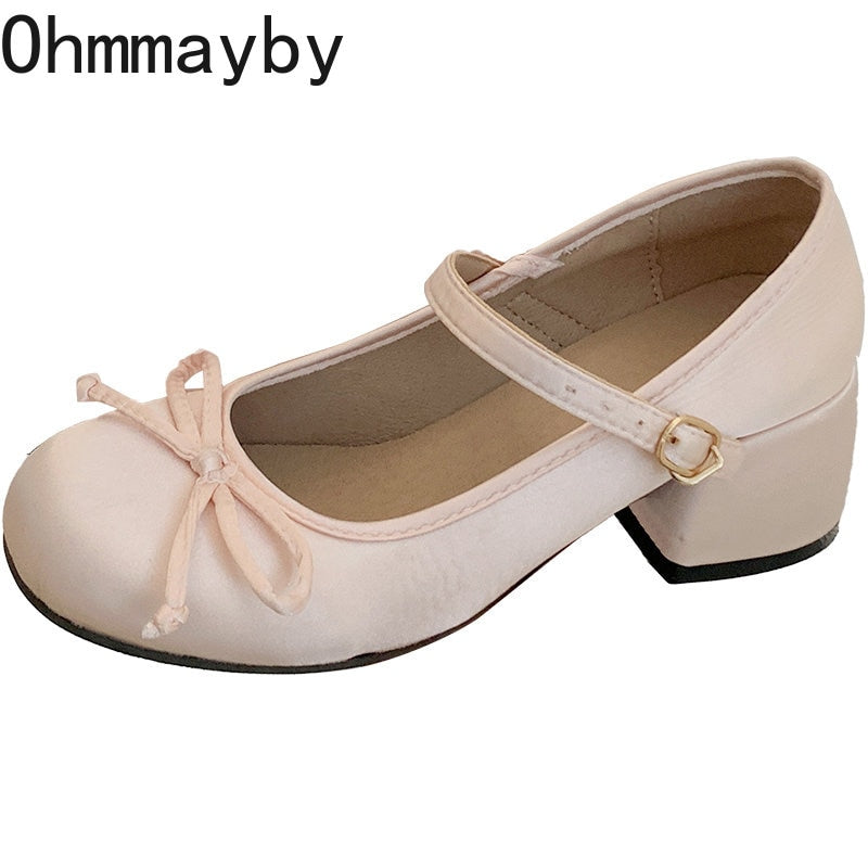 Blush pink Mary Jane ballet flats with ankle strap and bow on toe