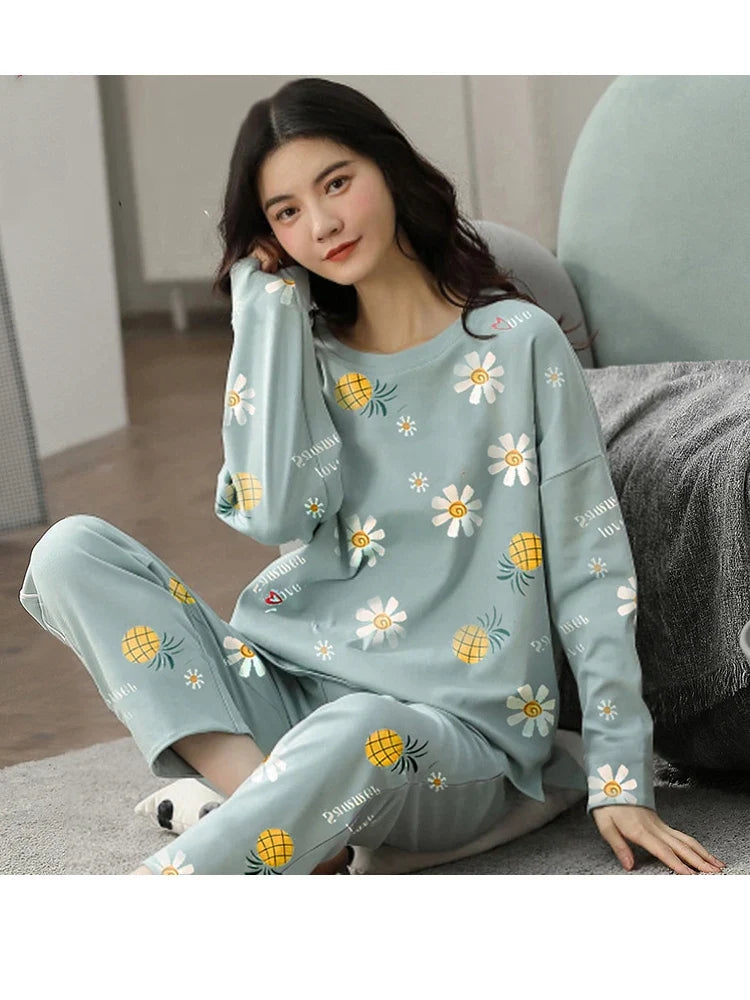 Women’s long-sleeve pajama set in light blue with daisy print top and pants