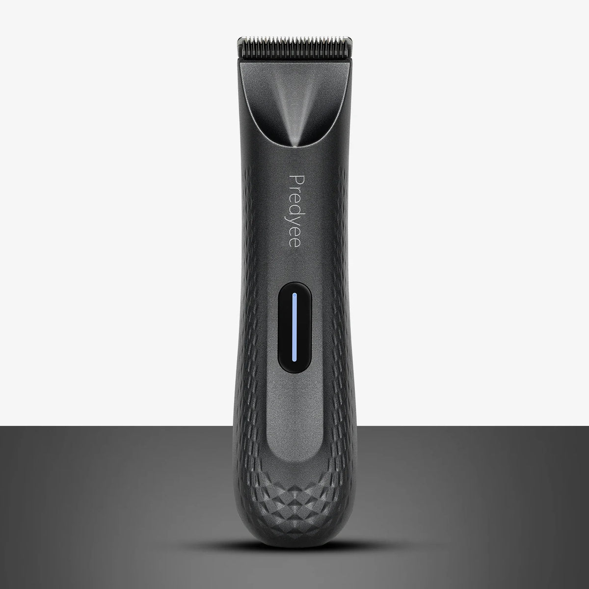 Dark gray electric hair trimmer with zoomed cutting head and blue indicator slot