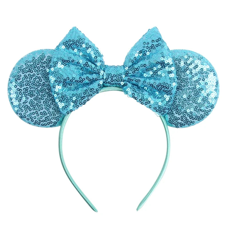 Light blue sequin Mickey-style ears headband with bow and matching curved band.