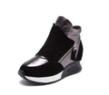 Black ankle boots with faux fur cuff, silver upper panel, side zipper, chunky sole