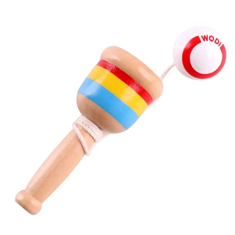 Wooden cup-and-ball handle with rainbow rings and a red-and-white ball on string