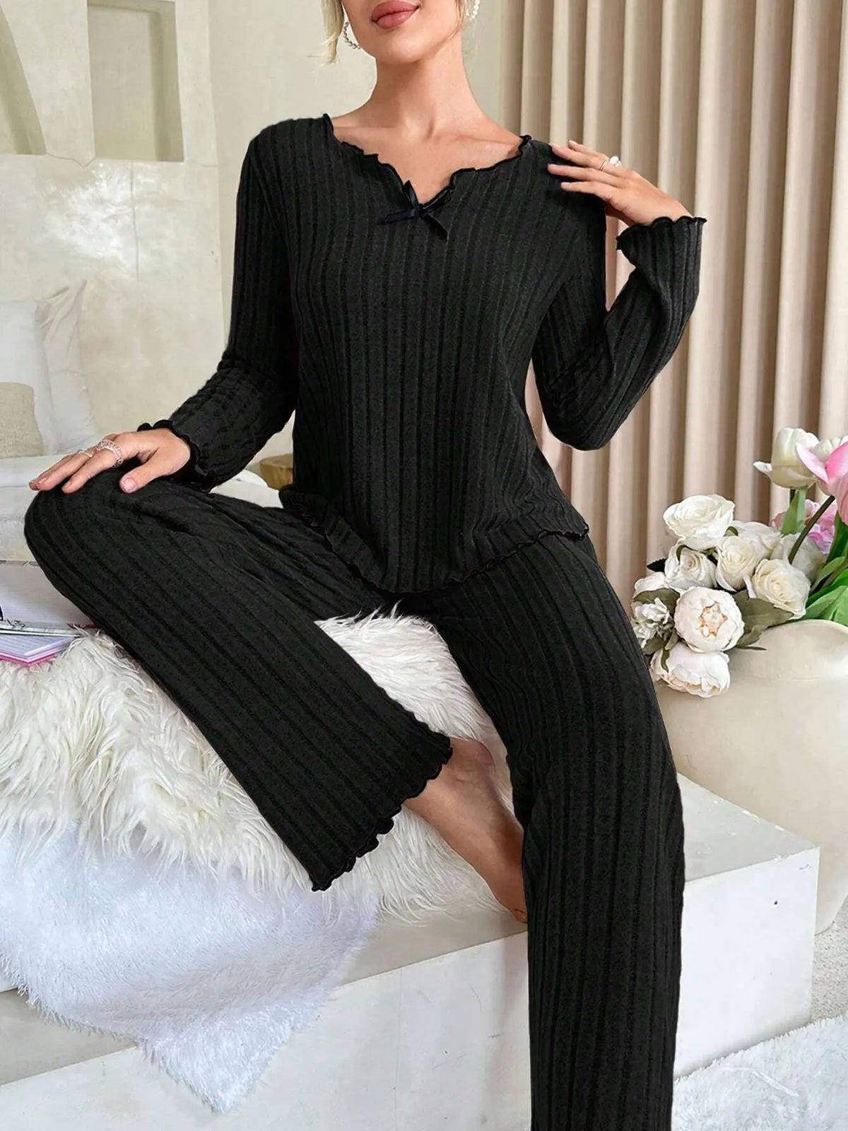 Women’s long-sleeve pajama set in black rib knit with scallop-trim neckline and pants
