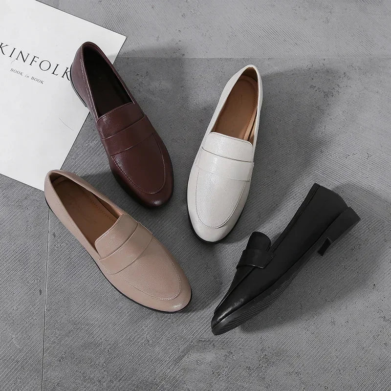 Assorted slip-on leather loafers with round toe in dark brown, beige, white, and black