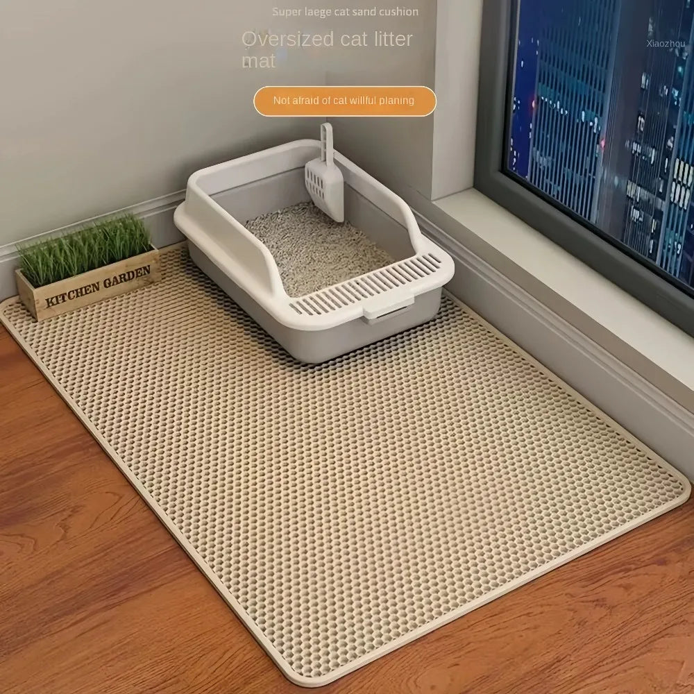 Oversized cream cat litter mat with raised lip, textured honeycomb surface