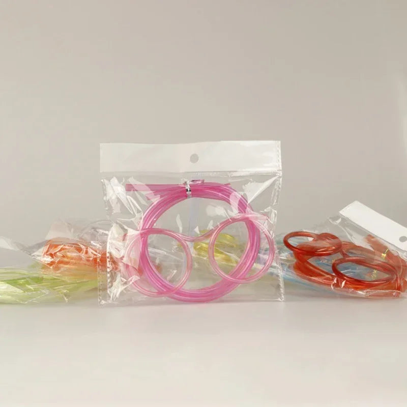 Pink novelty straw glasses set in clear bag with built-in drinking straw
