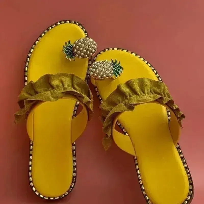 Yellow flat slide sandals with pearl pineapple ornaments and ruched ruffle straps