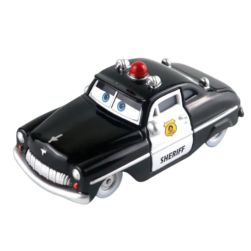 Black diecast sheriff race car model with red roof light and white stripe, angled view