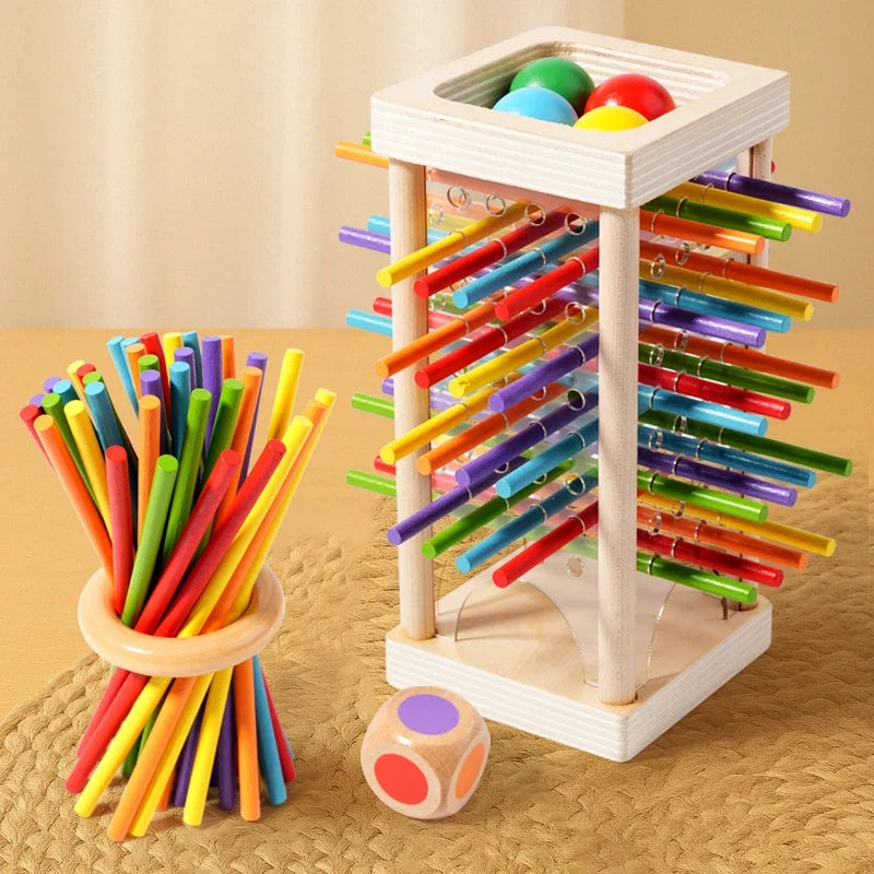 Wooden stick battle game tower with colorful sticks and two wooden dice