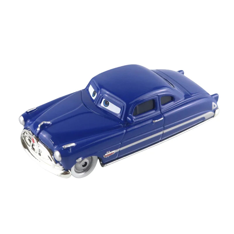 Blue diecast race car model with cartoon face and silver wheels