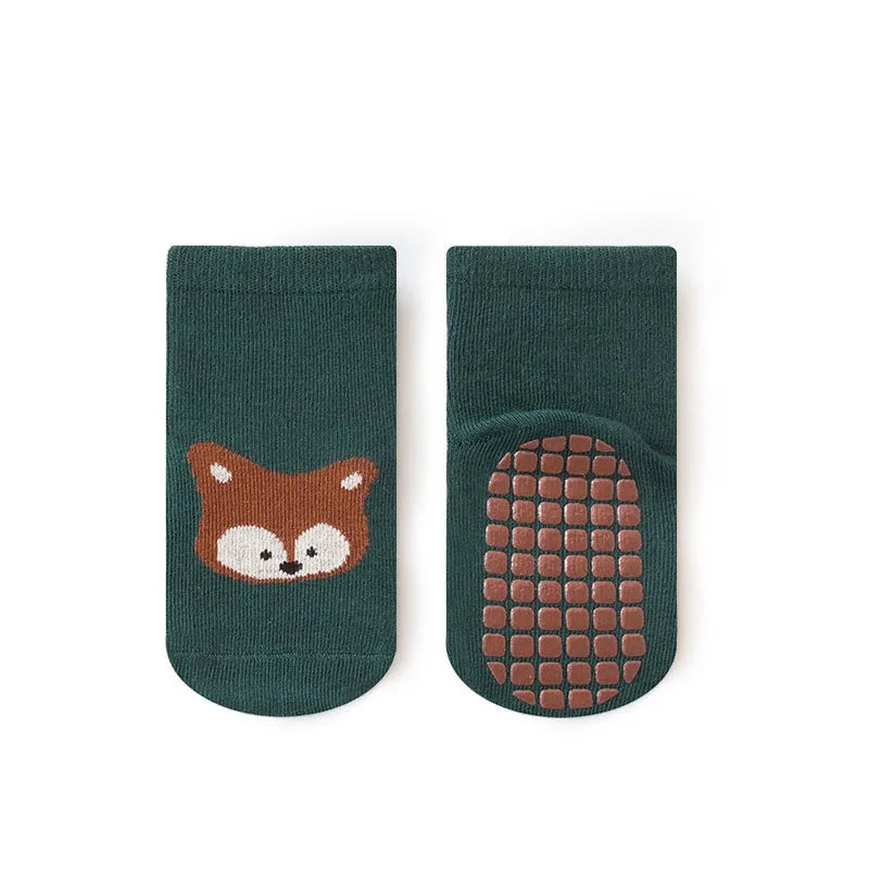 Pair of green fox-face non-slip socks with gripped sole pattern