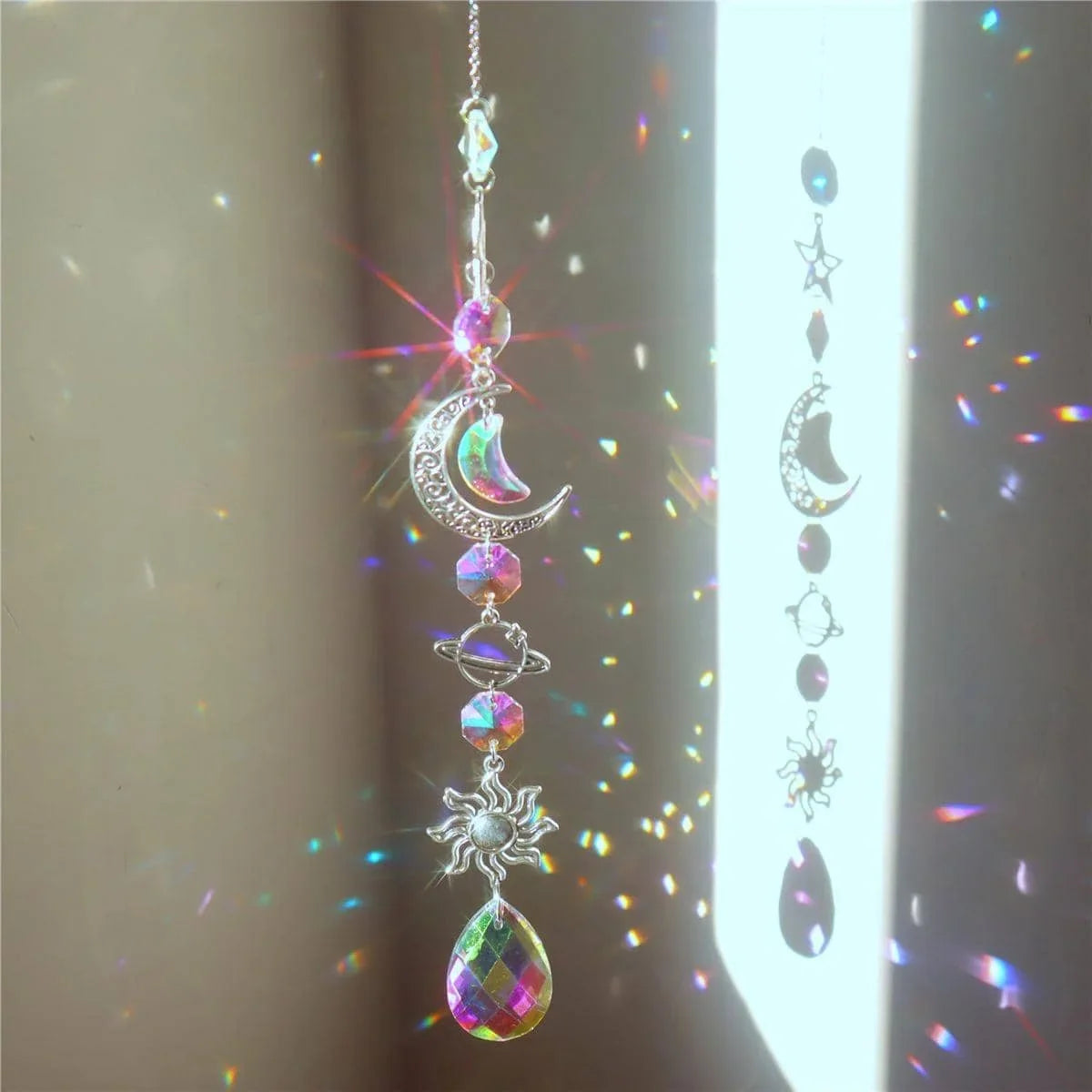 Hanging crystal wind chime with rainbow teardrop prism, crescent moon and star charms