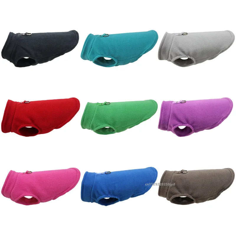 Assorted color fleece pet jacket vests with D-rings, shown in multiple shades