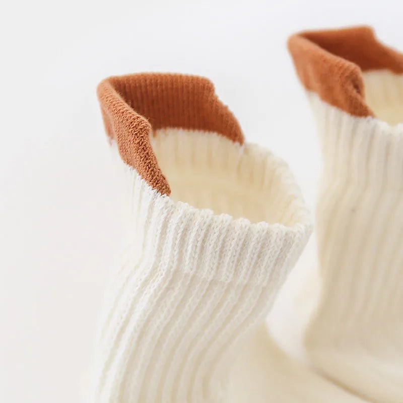 Kids cotton ankle socks with white body and rust-brown cuffs, non-slip dot grippers