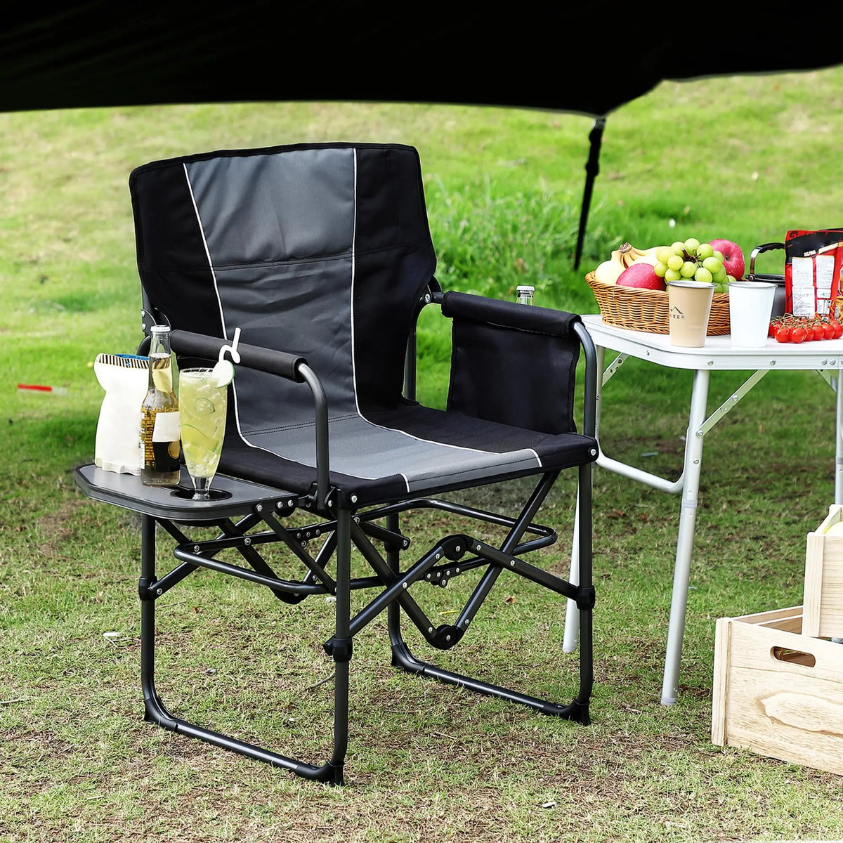 Grey folding director camping chair with flip-up side table and side storage pockets