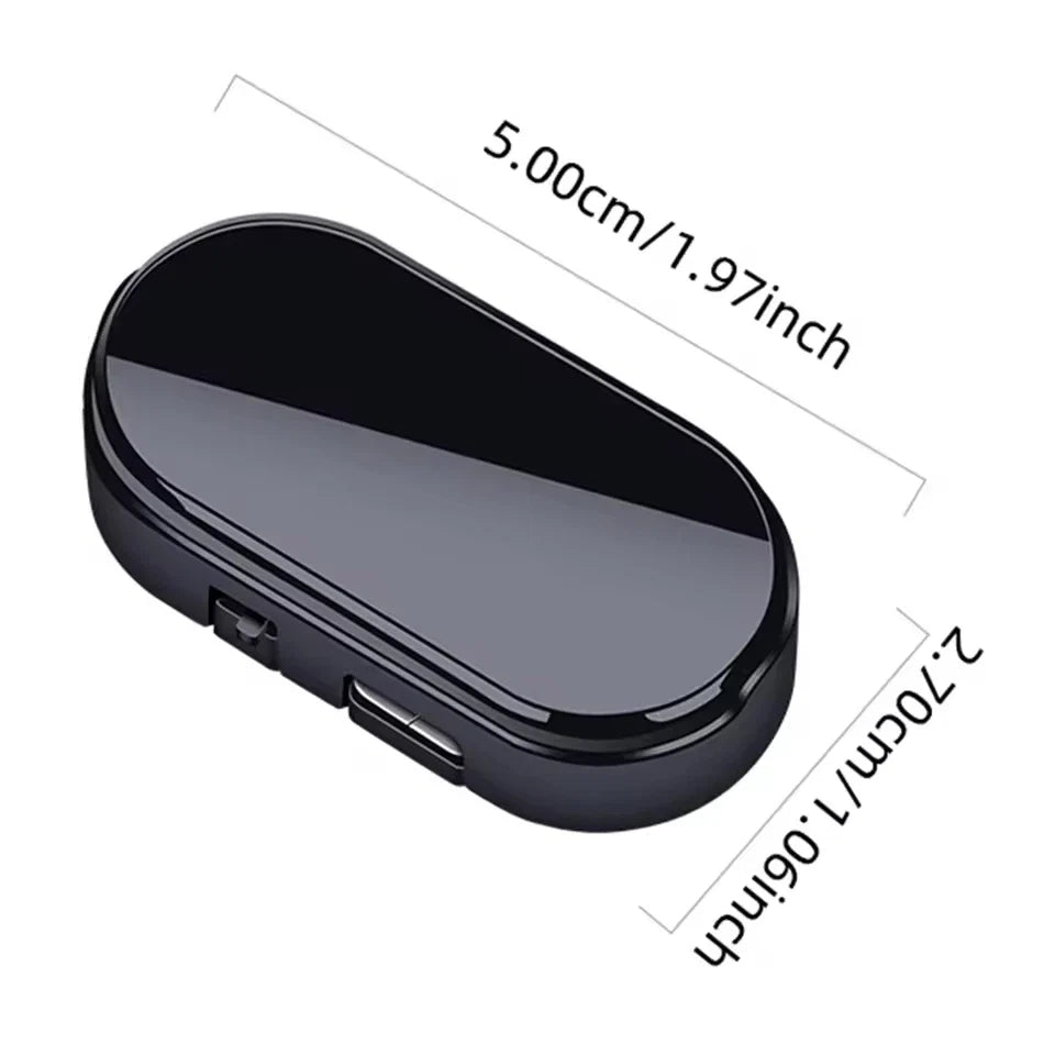 Black solar dummy alarm light, oval housing with ports, shown with size outline