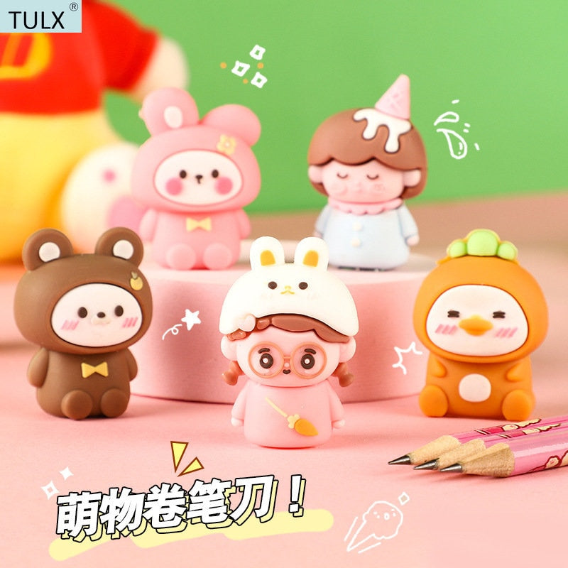 Set of cute animal pencil sharpeners with small figure designs, pink and orange colors.
