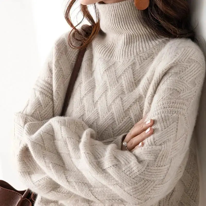 Cream oversized pullover sweater with ribbed turtleneck and cable-knit diamond pattern