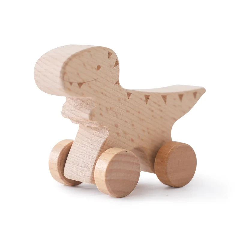 Wooden dinosaur teether toy on wheels with engraved details on body and tail