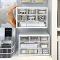 White plastic desk organizer with two open sections and modular compartments for stationery