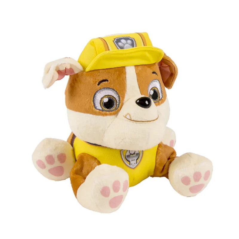 Brown and white plush puppy doll with yellow cap and vest, seated stuffed toy