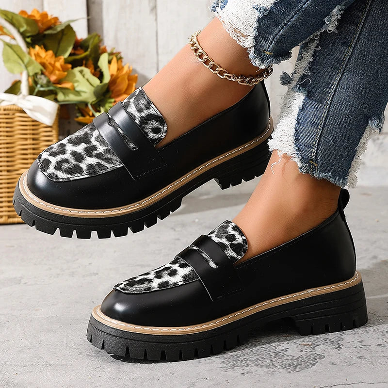 Women’s black loafers with leopard-print front strap, platform sole, slip-on fit