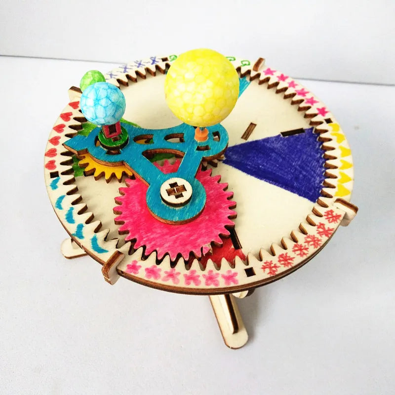Solar system wooden puzzle kit with multicolor gears and three painted planet spheres