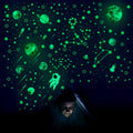 Glow-in-the-dark space wall sticker set with planets, stars, and a rocket