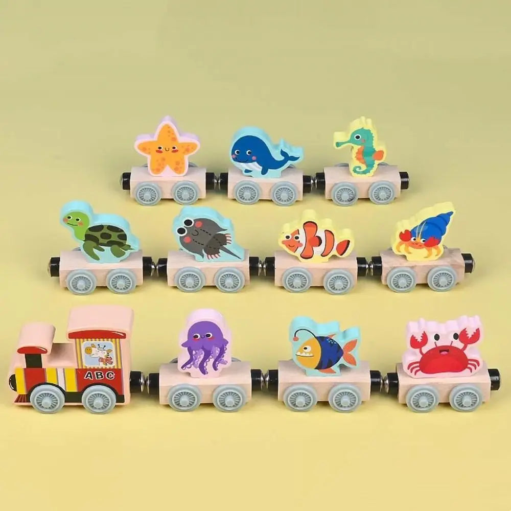 Wooden magnetic train set with ocean animal block toppers, including whale, crab, and seahorse