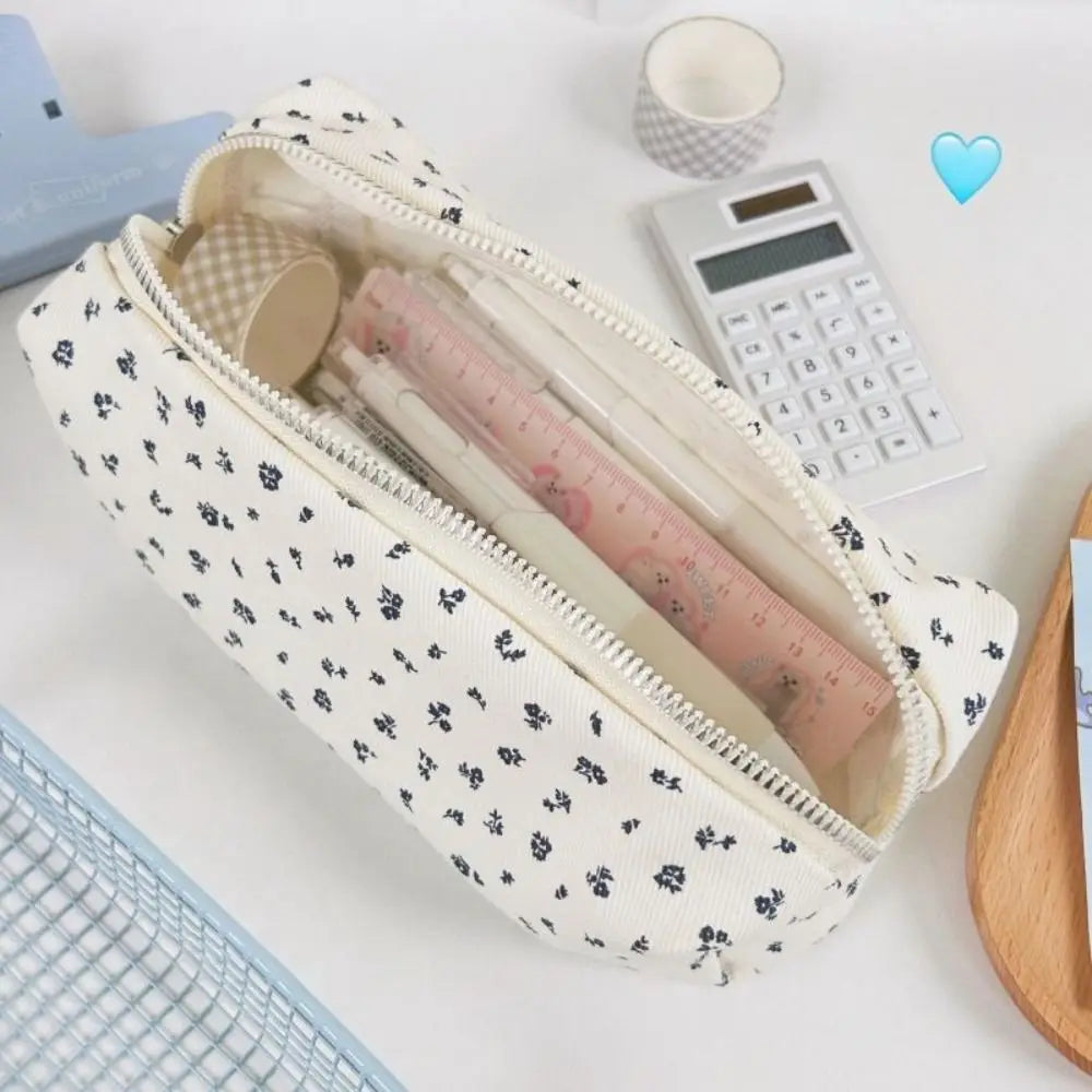 Floral canvas pencil case with navy flower print, open top and zipper