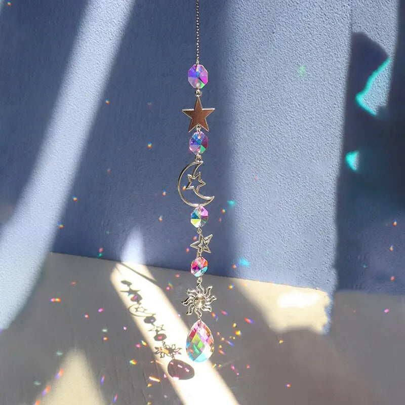 Hanging crystal wind chime with sun and star charms, crescent piece and rainbow faceted beads
