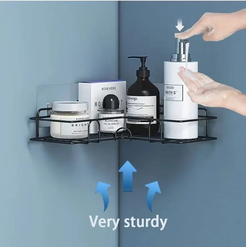 Black metal two-tier wall shelf organizer holding toiletries; hand press dispensing