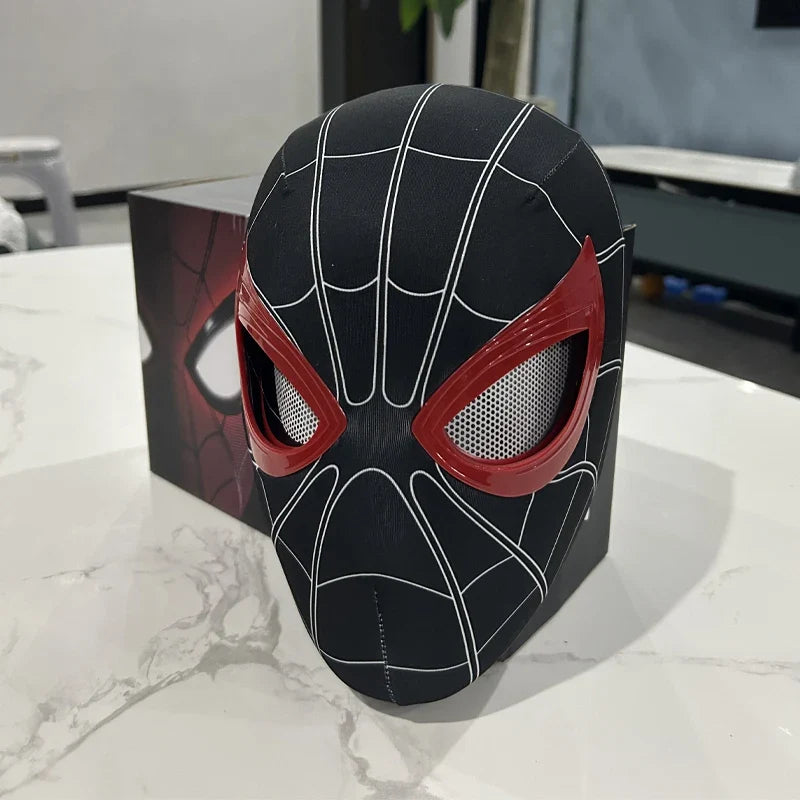 Black electronic face mask with red mesh eye panels and white web lines