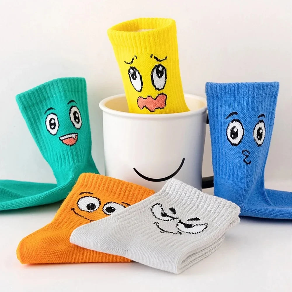 Kids crew socks 5-pair set with smiley faces in yellow, teal, blue, orange, white.