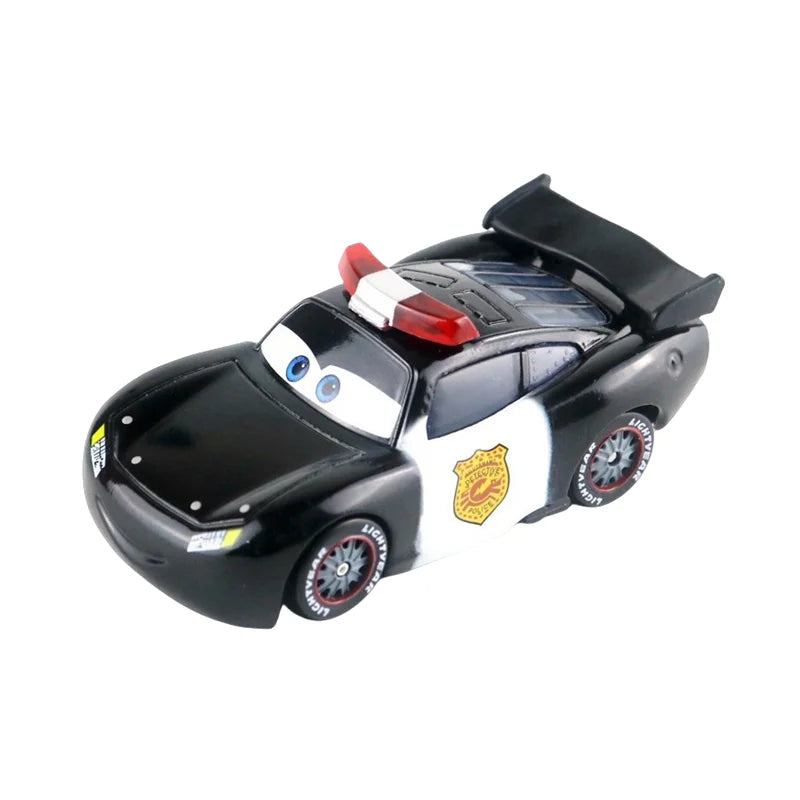 Diecast race car model, black and white with red detail on hood