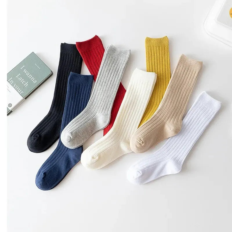 Kids knee-high striped socks set in black, navy, red, gray, white, yellow, and beige.