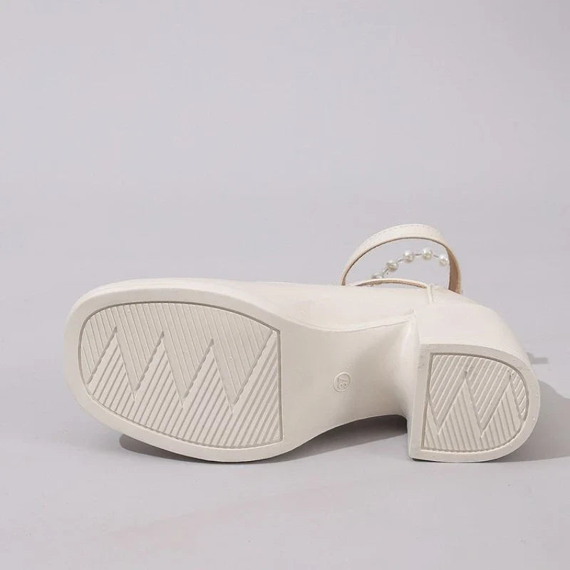 Off-white Mary Jane heel shoe outsole with tread pattern and small logo