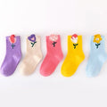 Lineup of five girls crew socks in purple, cream, pink, yellow, and light blue flower prints