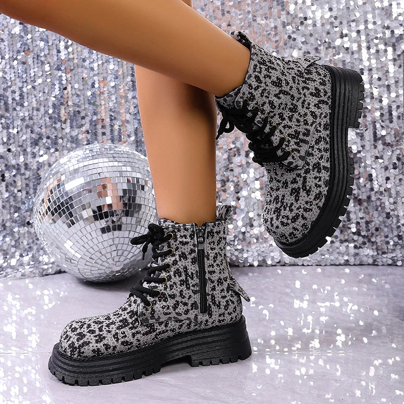 Leopard print lace-up ankle boots with chunky platform sole and textured tread