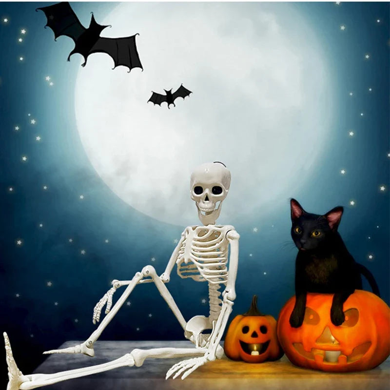 Small white skeleton humanoid decoration holding a side-to-side pose with bat wings