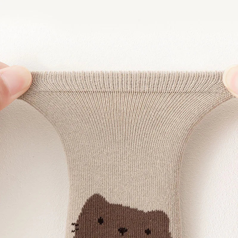 Knitted cuff and bear face graphic on beige non-slip sock