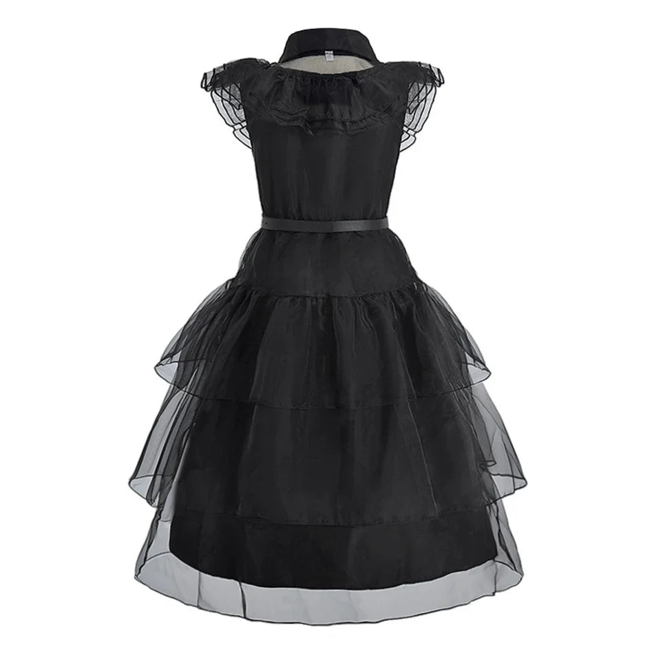 Black sleeveless kids dress with puff cap sleeves, fitted bodice and layered tulle skirt