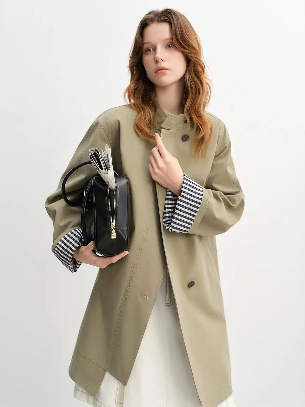 Green stand-collar windbreaker with black-and-white plaid cuffs, snap buttons, side pockets