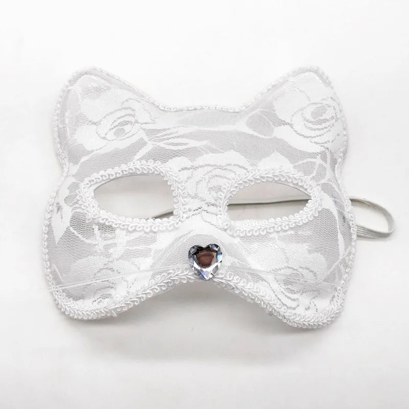 White lace cat masquerade mask with heart-like jewel center, ribbon ties, eye cutouts
