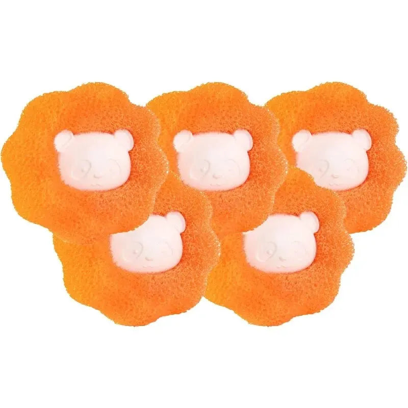 Set of orange plush bear laundry hair remover balls